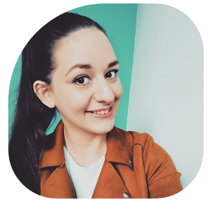 image of a webnotts developer smiling in front of a green wall